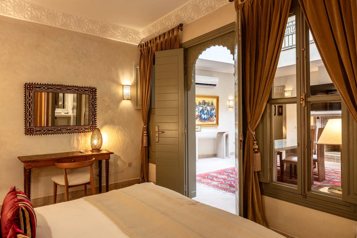 The Patio Room's carved archway and dressing area